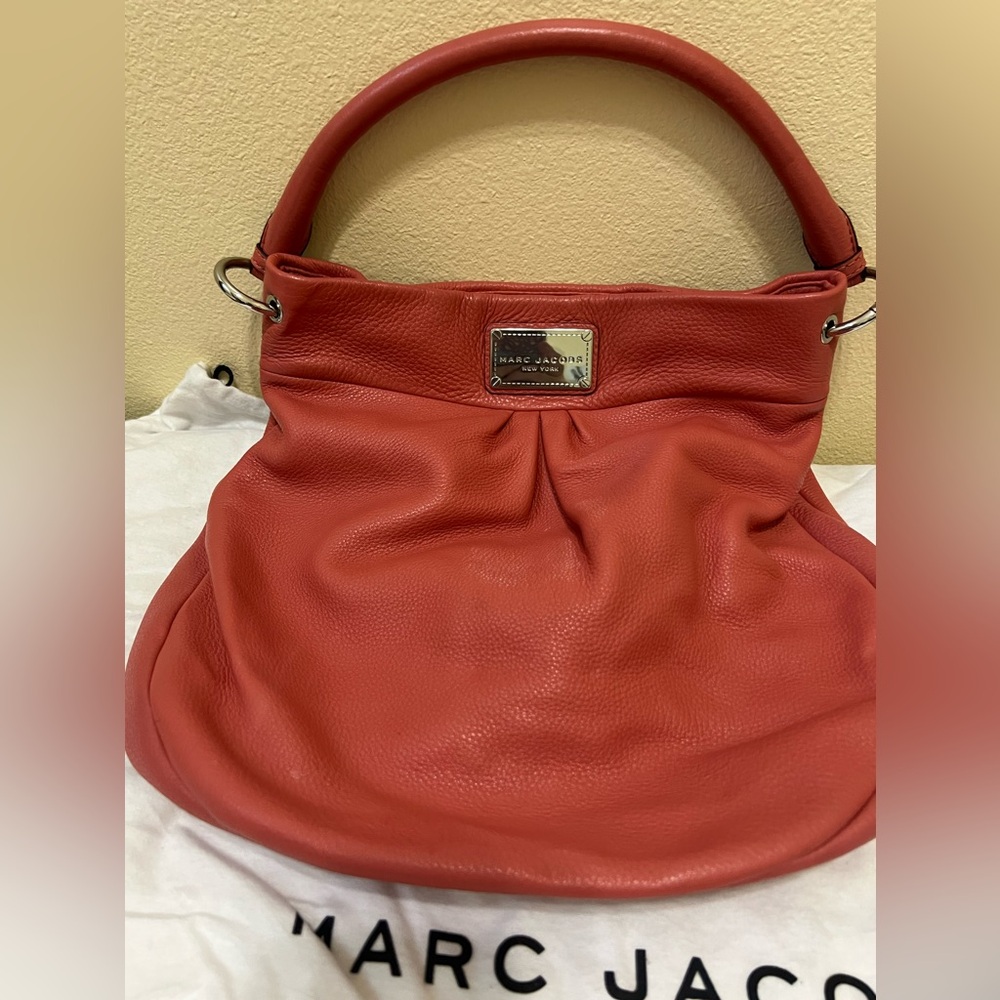 Marc Jacobs woman’s bucket coral purse.